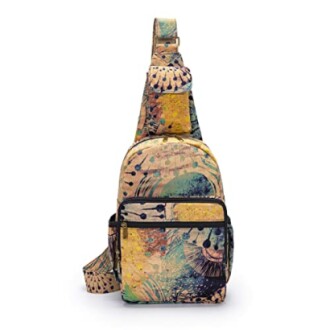 Colorful abstract patterned sling bag with multiple pockets.