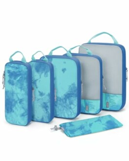 Set of blue tie-dye travel packing cubes in various sizes.