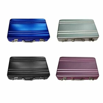 Four metal briefcases in blue, gray, black, and purple.