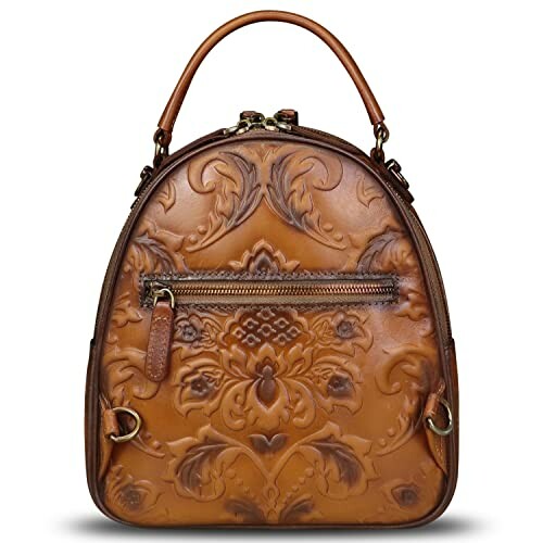 Brown leather backpack with embossed floral design