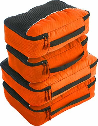 Stack of orange packing cubes with zippers.