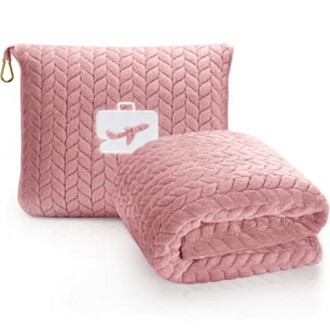 Pink travel blanket set with a carrying pouch.