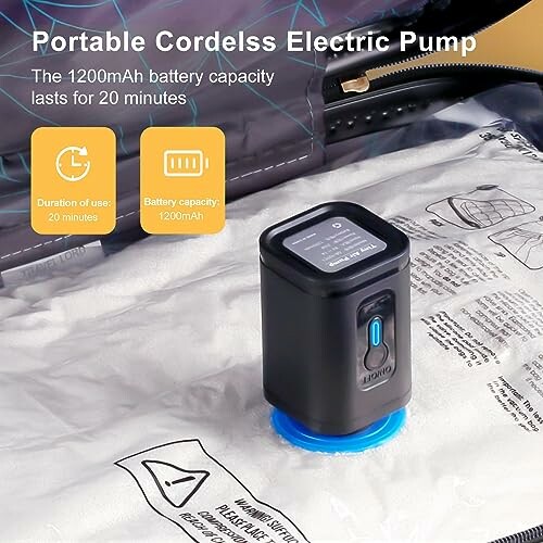 Portable cordless electric pump on vacuum storage bag.