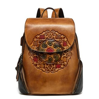 Brown vintage leather backpack with ornate embossed design